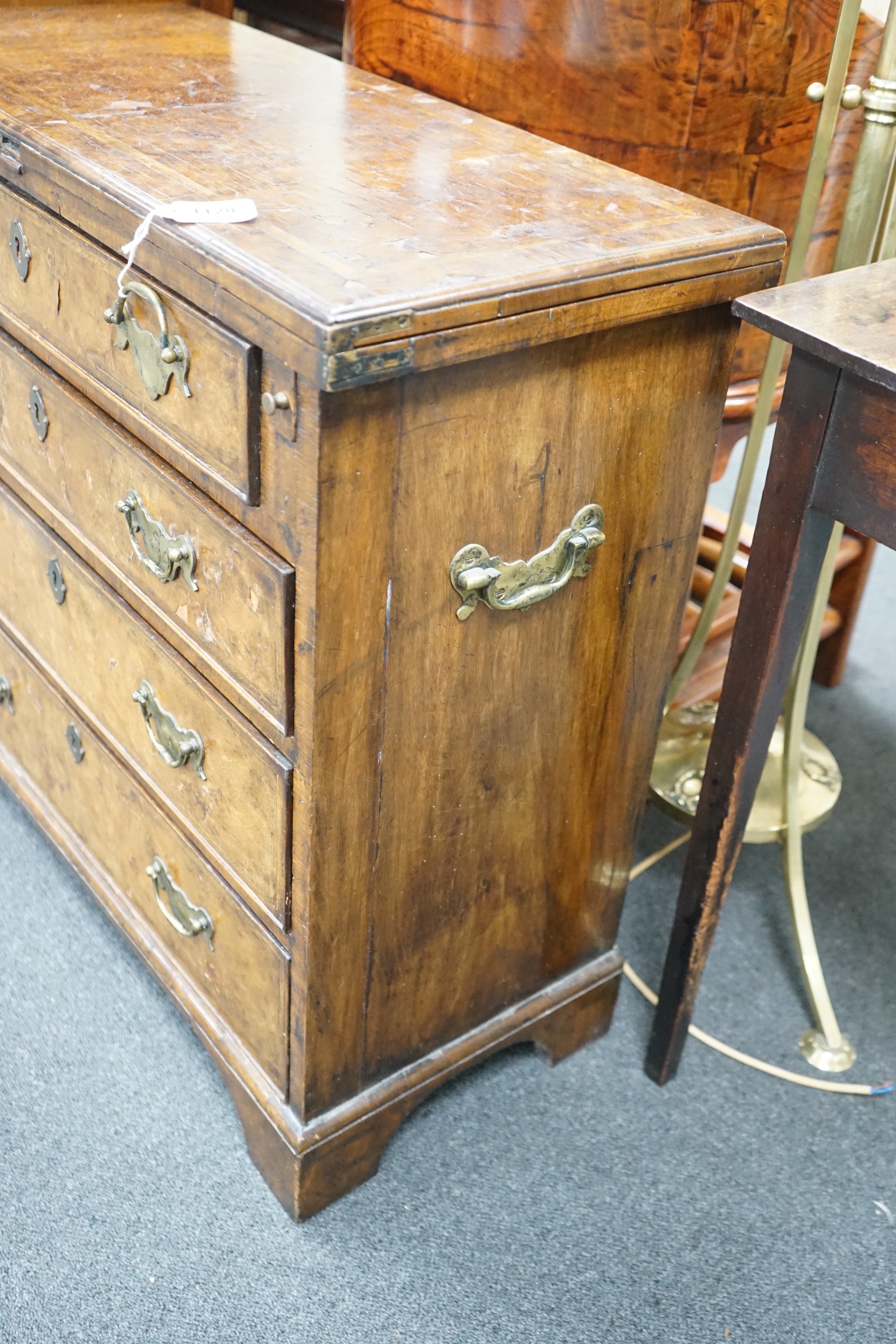 An early 18th century style feather banded walnut bachelor's chest, width 76cm, depth 34cm, height 75cm